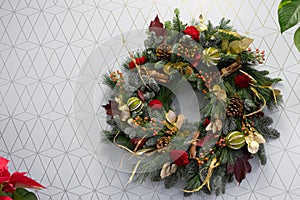 Christmas wreath on a white background with a pattern of geometric shapes photo