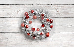 Christmas Wreath on White Wooden Background, Hanging Decoration on Wood Planks Wall
