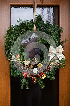 Christmas wreath on wood front door