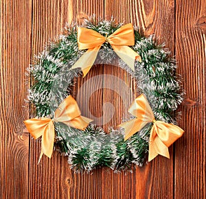 Christmas wreath on wooden background as Christmas decoration