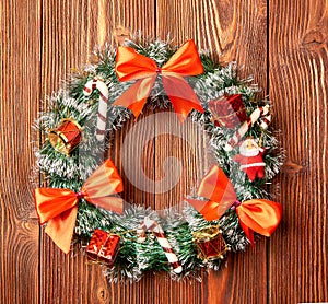 Christmas wreath on wooden background as Christmas decoration