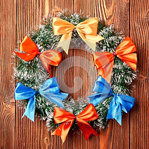 Christmas wreath on wooden background as Christmas decoration