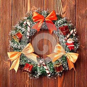 Christmas wreath on wooden background as Christmas decoration