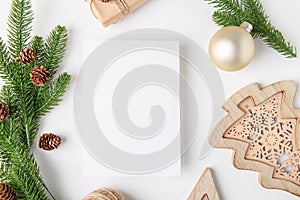 Christmas 5x7 card mockup template with fir twigs and golden stars on white background