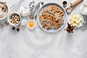 Christmas or X-mas baking culinary background, cooking recipe. Xmas gingerbread on kitchen table and ingredients for cooking