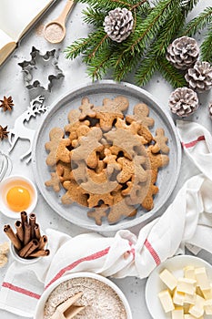 Christmas or X-mas baking culinary background, cooking recipe. Xmas, Noel gingerbread cookies on kitchen table and ingredients