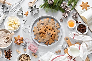 Christmas or X-mas baking culinary background, cooking recipe. Xmas, Noel gingerbread cookies on kitchen table and ingredients