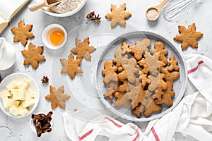 Christmas, X-mas or New Year baking culinary background, cooking recipe. Xmas gingerbread on kitchen table and ingredients