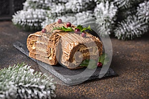 Christmas yule log cake. Traditional chocolate dessert