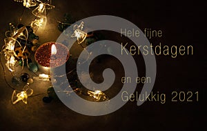 Christmascard in Dutch with candle and lights