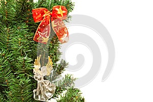 Christmass tree branches with angel and ribbons