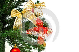 Christmass tree branches with balls and ribbons