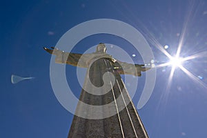 Christo rei statue with sun flare