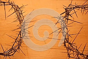 christs crown with thorns on old wooden background