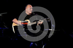 Christy Moore perform onstage in Ballinasloe