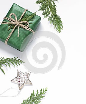 Chritsmas celebration concept frame with gift box on the white backdround.