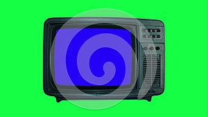 Chroma key TV monitor. Vintage TV with blue screen on a green background. Copy space on retro tv display close-up