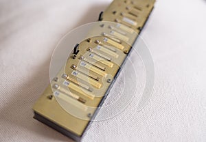 Chromatic harmonica-reed plates, windsavers and valves.