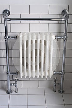 A chrome bathroom radiator