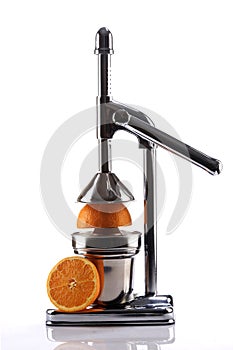 Chrome Citrus Juicer and Orange Halves photo