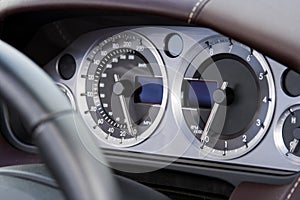 Chrome dials on fast modern car photo