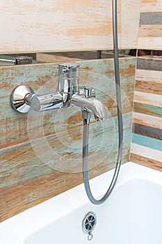 Chrome faucet in the bathroom. Bathroom interior