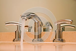 Chrome faucet in luxury bathroom