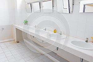 Chrome faucet old white sink in interior bathroom public with copy space add text