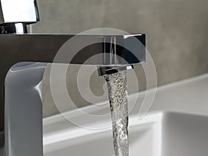 Chrome faucet with running water
