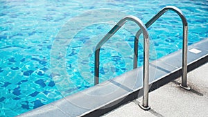 Chrome handrails of the swimming pool photo