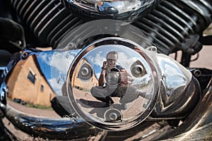 Chrome-plated four-stroke internal combustion engine of an old touring motorcycle in macro