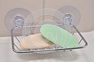 Chrome soap tray, wall mounted holder dish, white porcelain china basin, beige tiles, used green, creamy ivory soap bars, large
