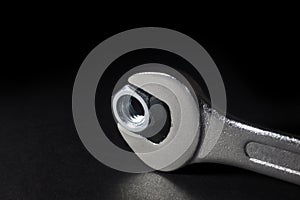 Chrome-Vanadium Spanner Gripping Nut On Black