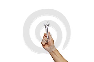 A chrome vanadium spanner on hand isolated over white background. wrench, man`s hand holding spanner, isolated