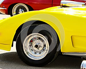 Chrome wheel on yellow car