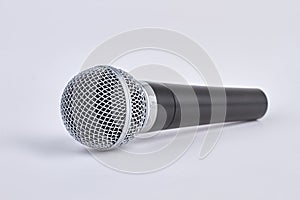 Chromed black wireless microphone isolated on white background.
