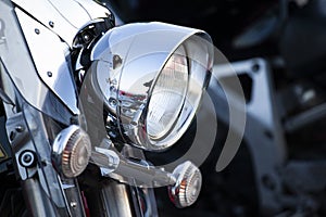 Chromed motorcycle headlights close up