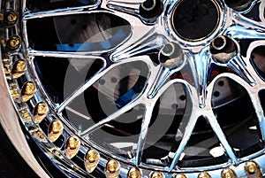 The chromeplated rim of a wheel