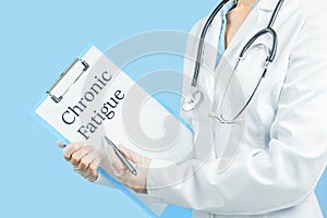 Chronic fatigue text on message pad. Female doctor photo