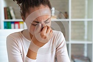 Chronic headache concept, young exhausted woman suffers from migraine