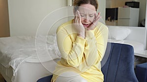 Chronic migraine, Headache pain, cerebral ischemia, woman suffering from headache at home