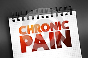 Chronic pain - classified as pain that lasts longer than three to six months, text concept on notepad