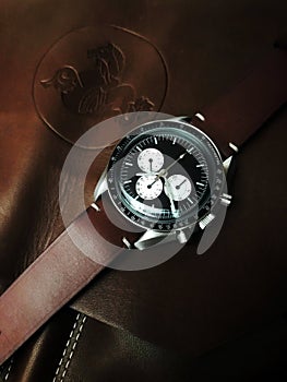 Chronograph wrist watch with metal or leather strap. Swiss made.
