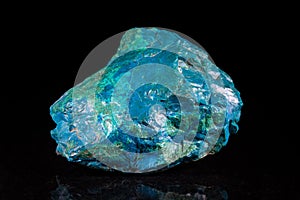 Chrysocolla mineral stone in front of black