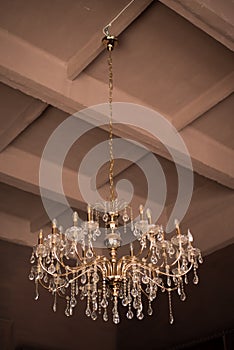 Chrystal chandelier lamp on the ceiling in Dining room Adjusting the image in a Luxury tone .Decorative elegant vintage and