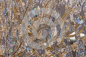 Chrystal lustre chandelier glittering closeup photo