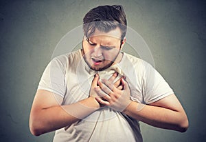 Chubby man having heart disease