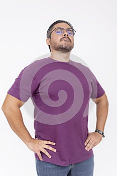 A chubby man wearing glasses looking smug and snobbish holding his head high. Half body photo, isolated on a white background