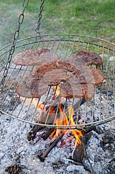 Chuck steaks being barbequed