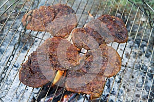 Chuck steaks being barbequed